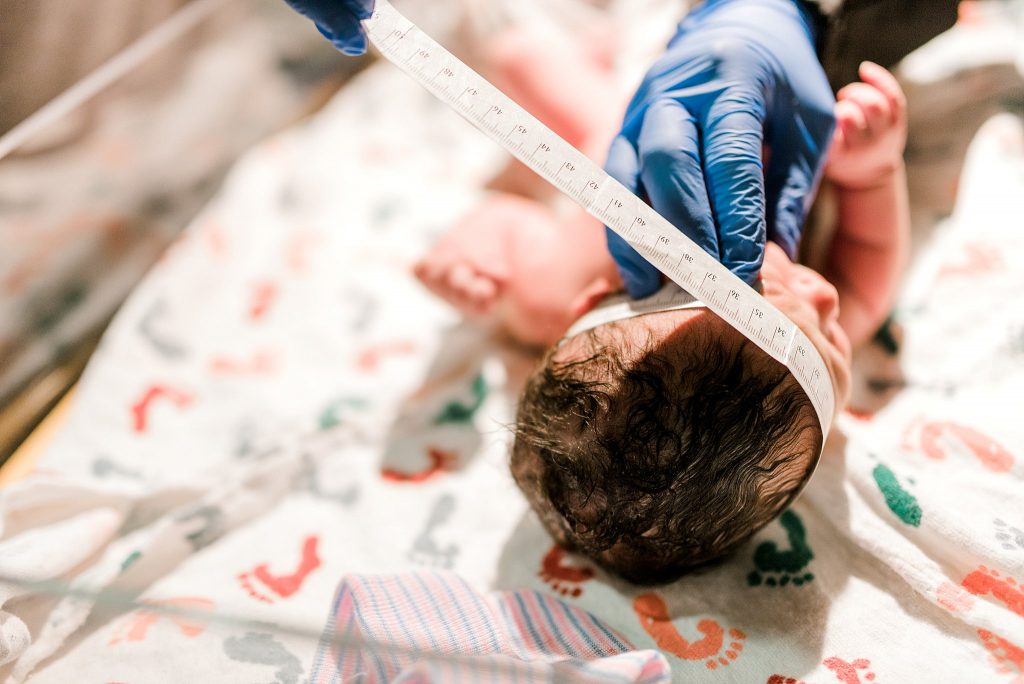 Nurse measuring babies head at birth at Baylor Hospital