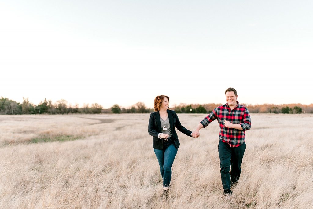 Grapevine Lake Engagement Session Running in an Open Field