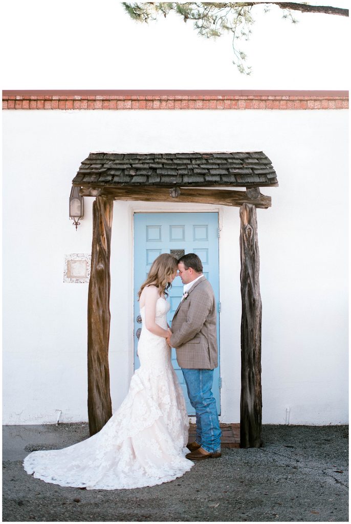 Bride and Groom Portraits in front of Blue Door
