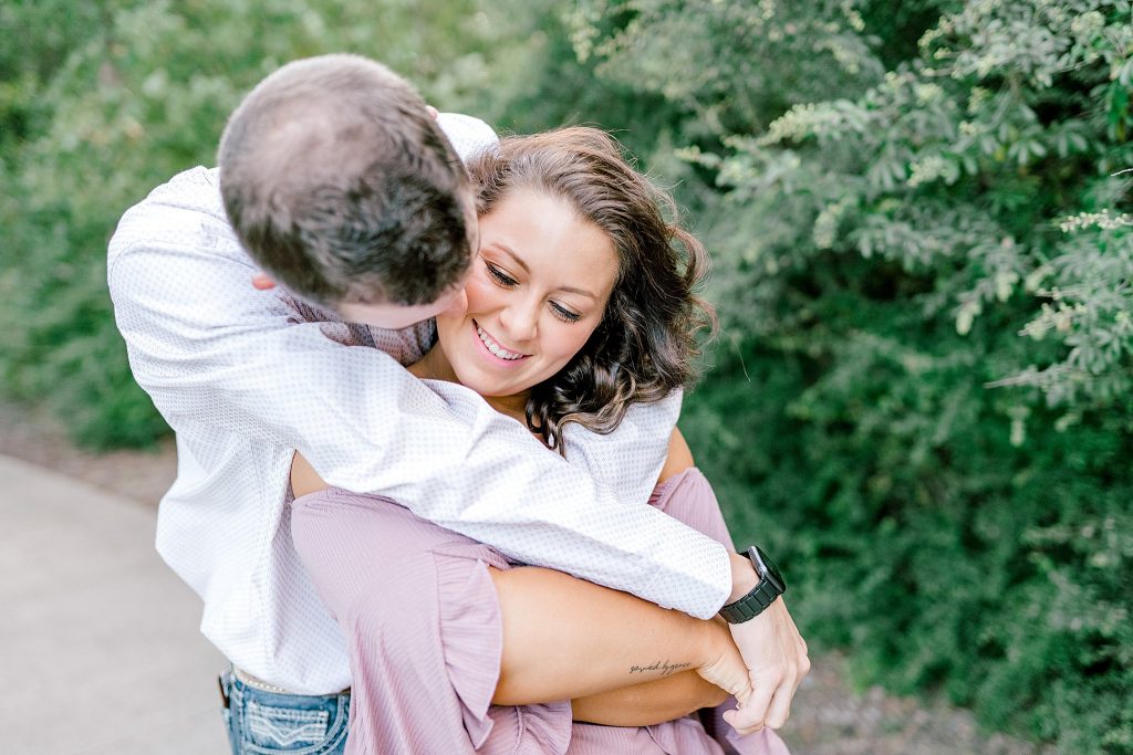 Bride and groom snuggling during their engagement session | Fort Worth Wedding Photographer