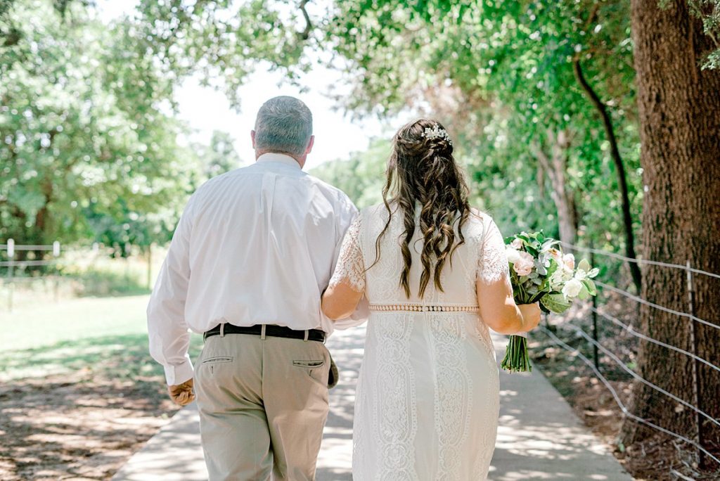 Bride walking with father for Lakeside DFW Texas elopement