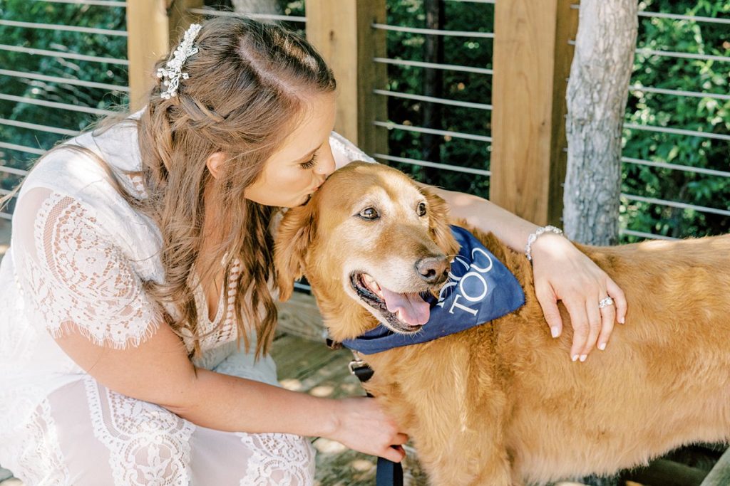 Bride kissing 'best dog' on head