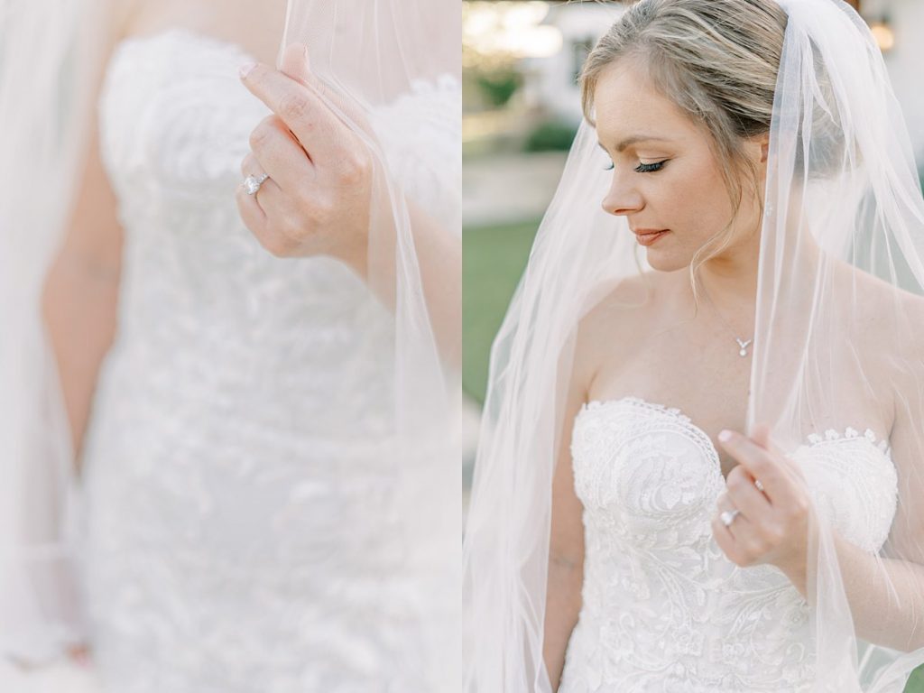 Bride looking down while holding wedding veil