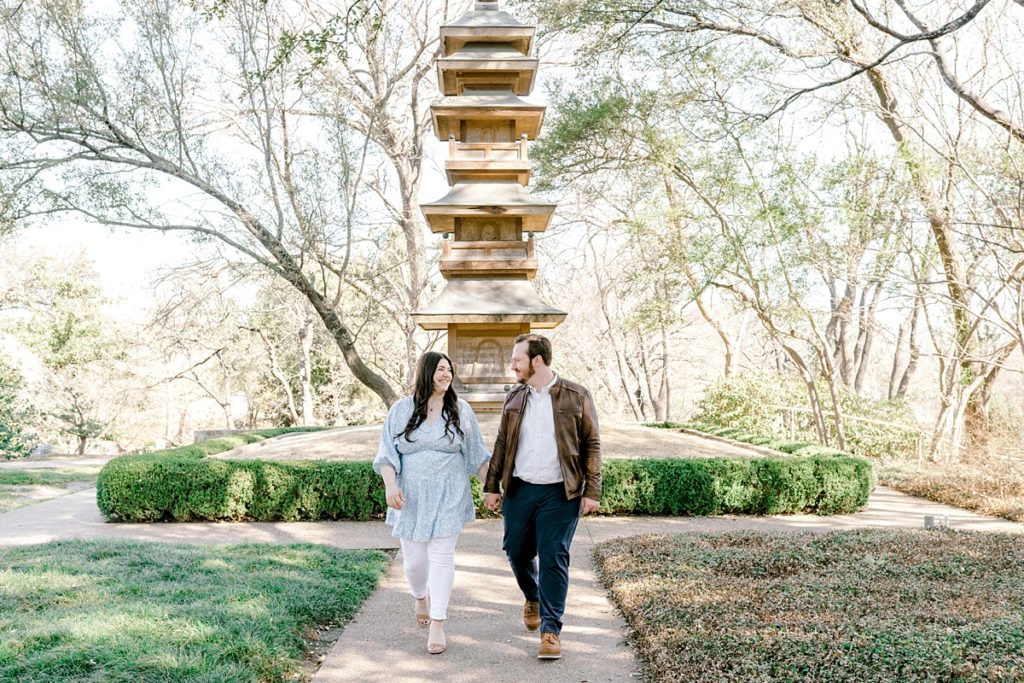 Couple walking through Fort Worth Japanese Botanical Garden