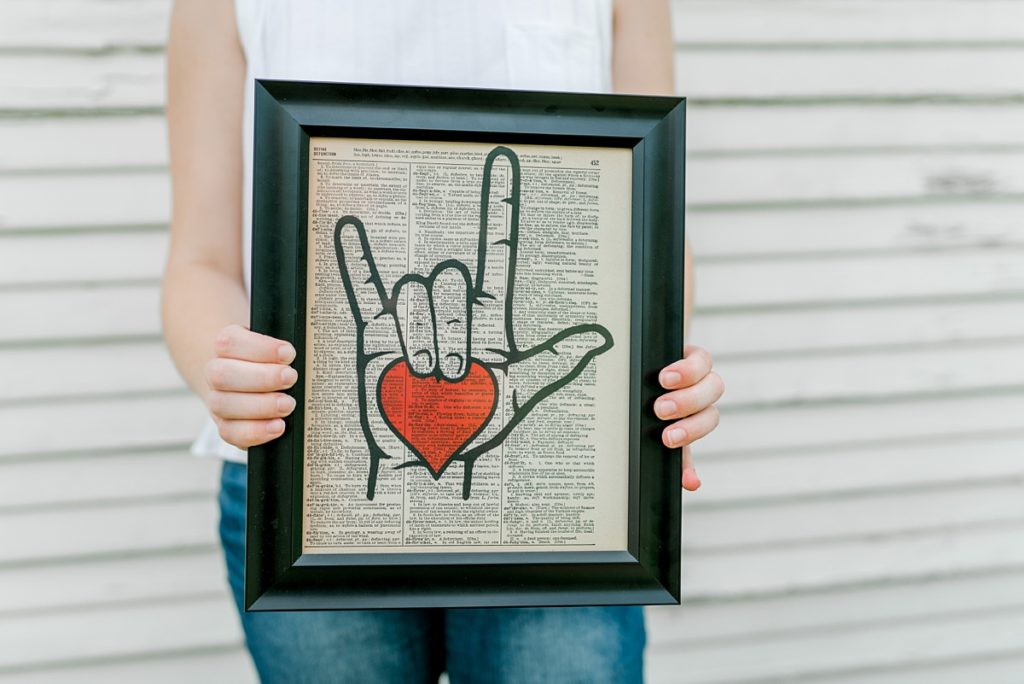 picture frame of hand making I love You sign in Timber Creek senior session