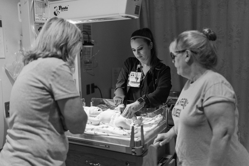 Grandmothers meeting new baby for first time after birth at Baylor Hospital 