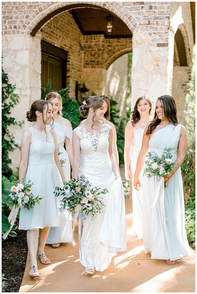 Bride walking with bridesmaids outside Hidden Waters Events| Light and airy wedding| Sabel Moments Photography