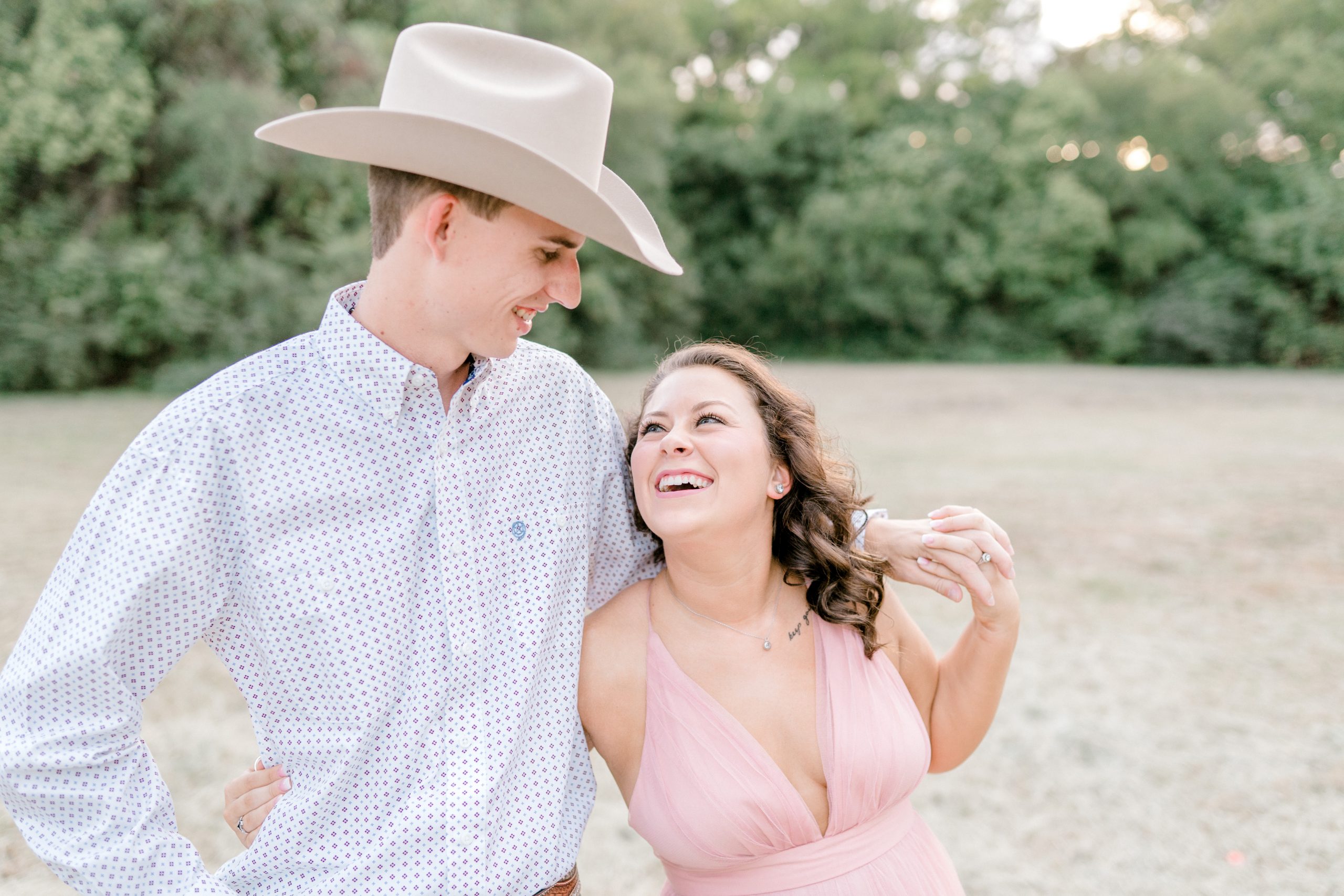 Bride and Groom laughing during their engagement session