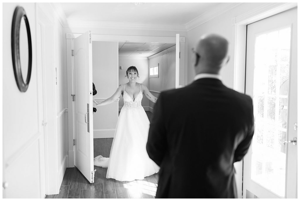 BW Bride walks out of room for father daughter first look
