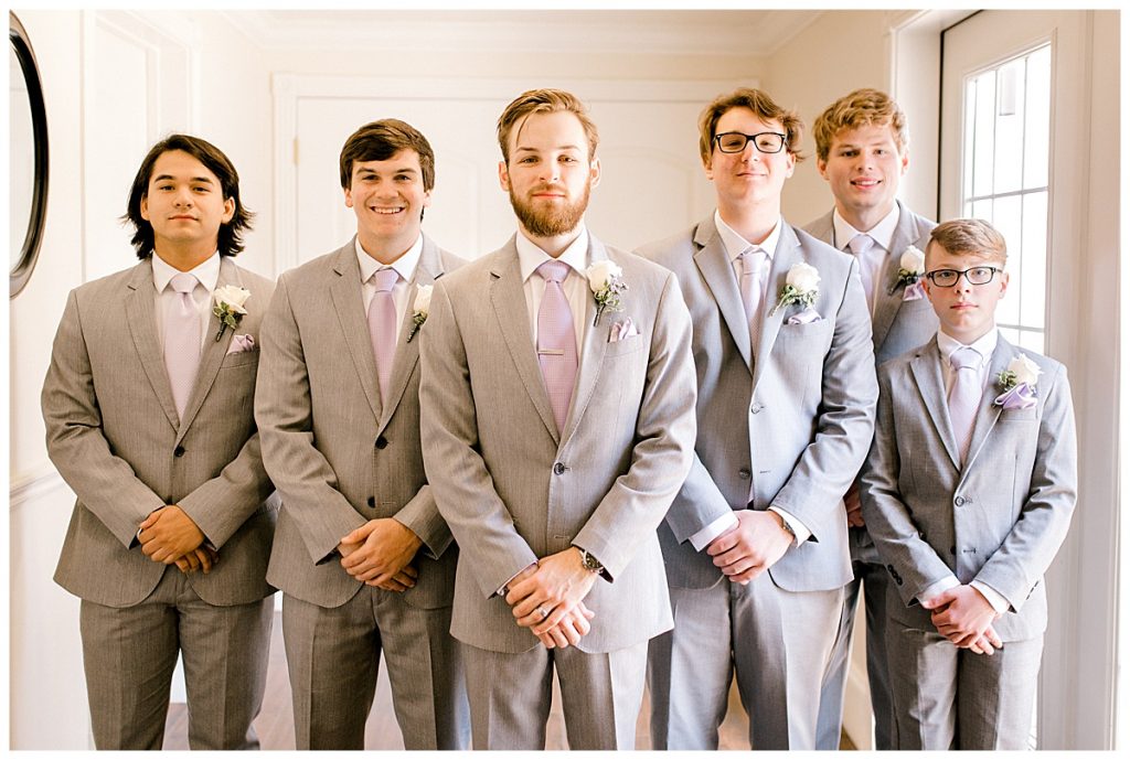Groom and groomsmen in grey and lavendar