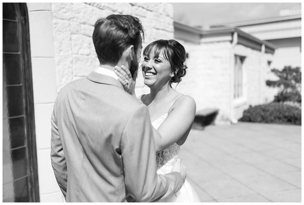 BW Bride smiling looking into grooms eyes