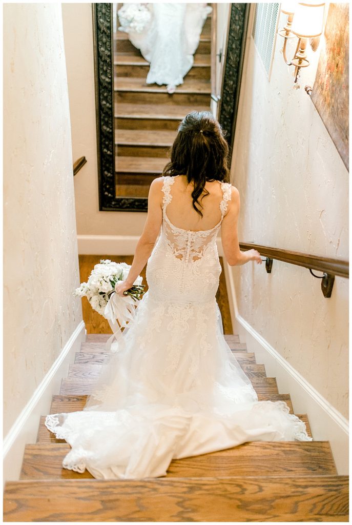 Bride walking down stairs at Hidden Waters Events wedding venue