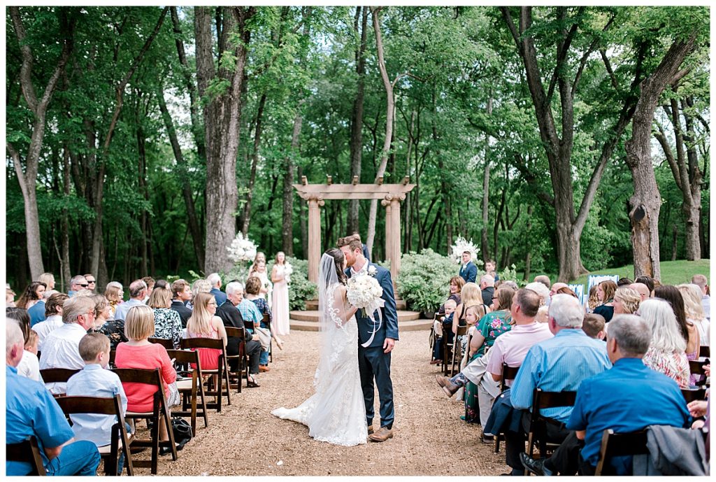 Bride and groom kiss outdoor Hidden Waters Events wedding