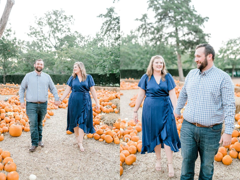Couple walking through the pumpkins 