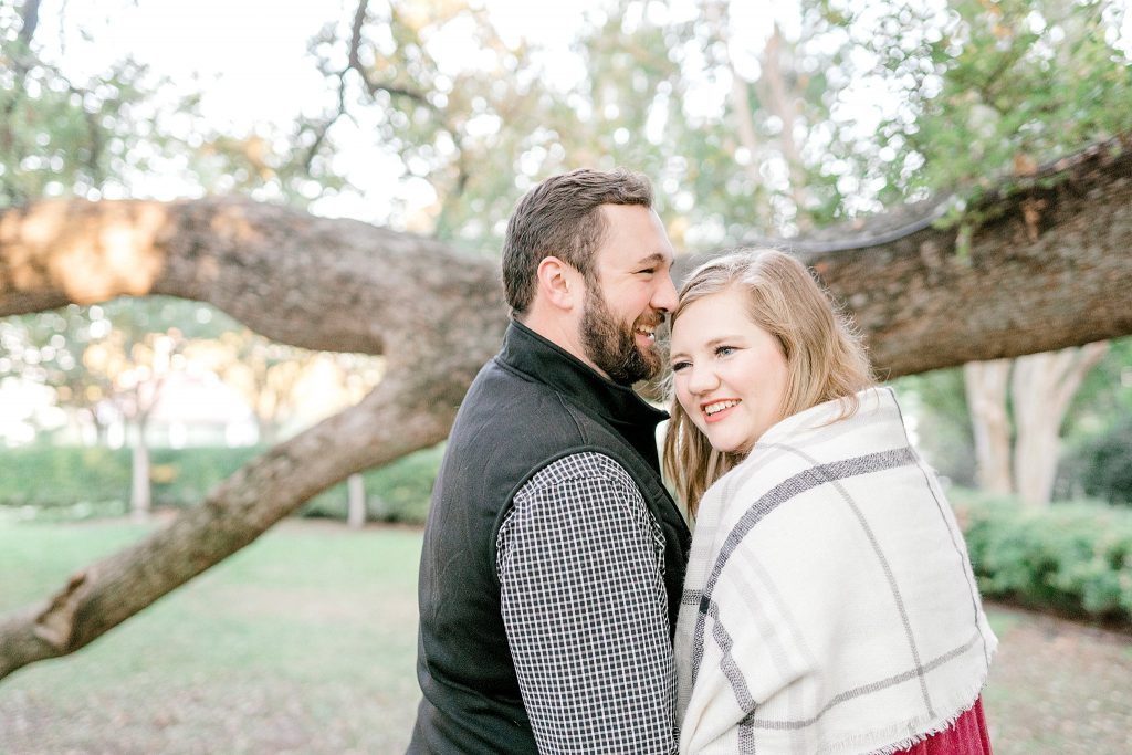 Laughing with each other during their Dallas Arboretum Engagement Session