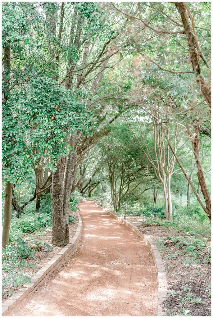 Wooded walking path at Clark Gardens Texas wedding venue