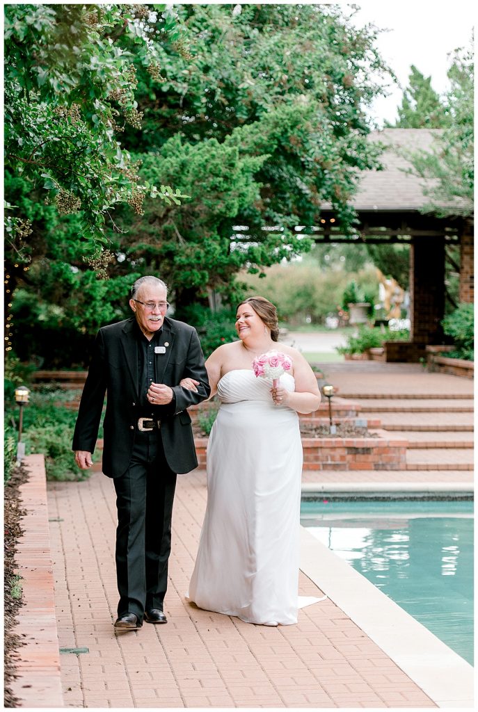 Bride walking down aisle with father at Clark Gardens wedding venue