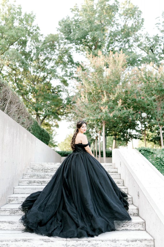 Bride in black princess ballgown on steps in Fort Worth bridal session 