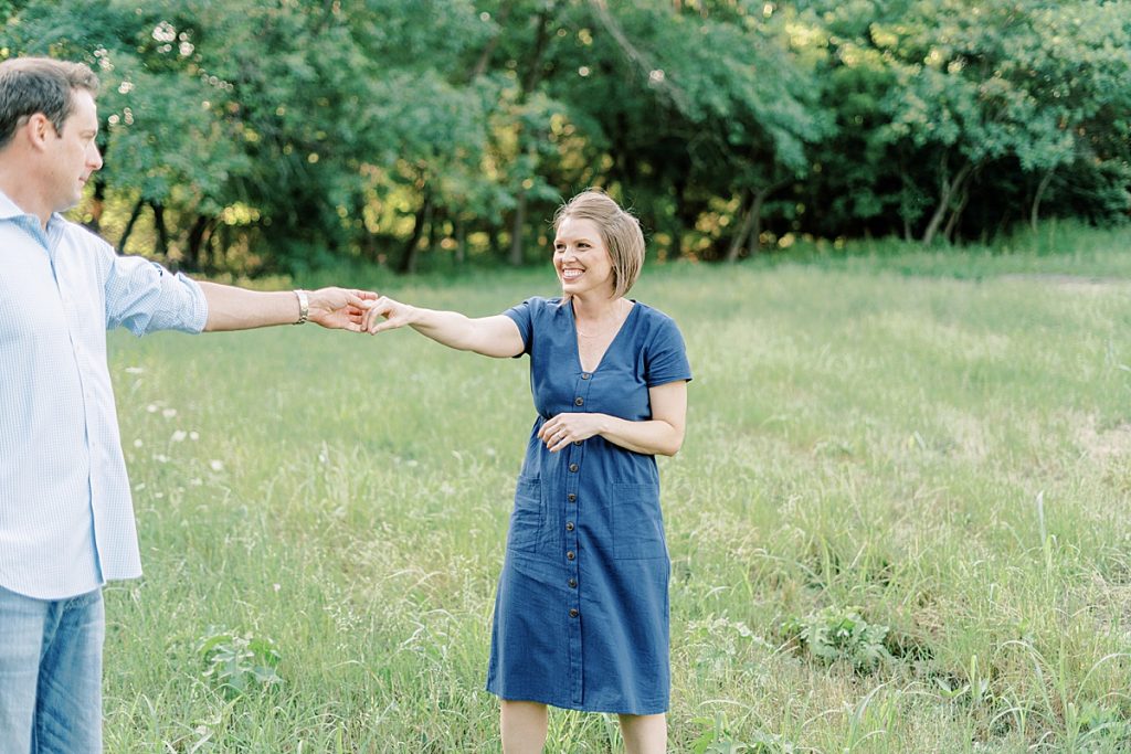 Couple dancing in field during their Airfield Falls Engagement Session 
