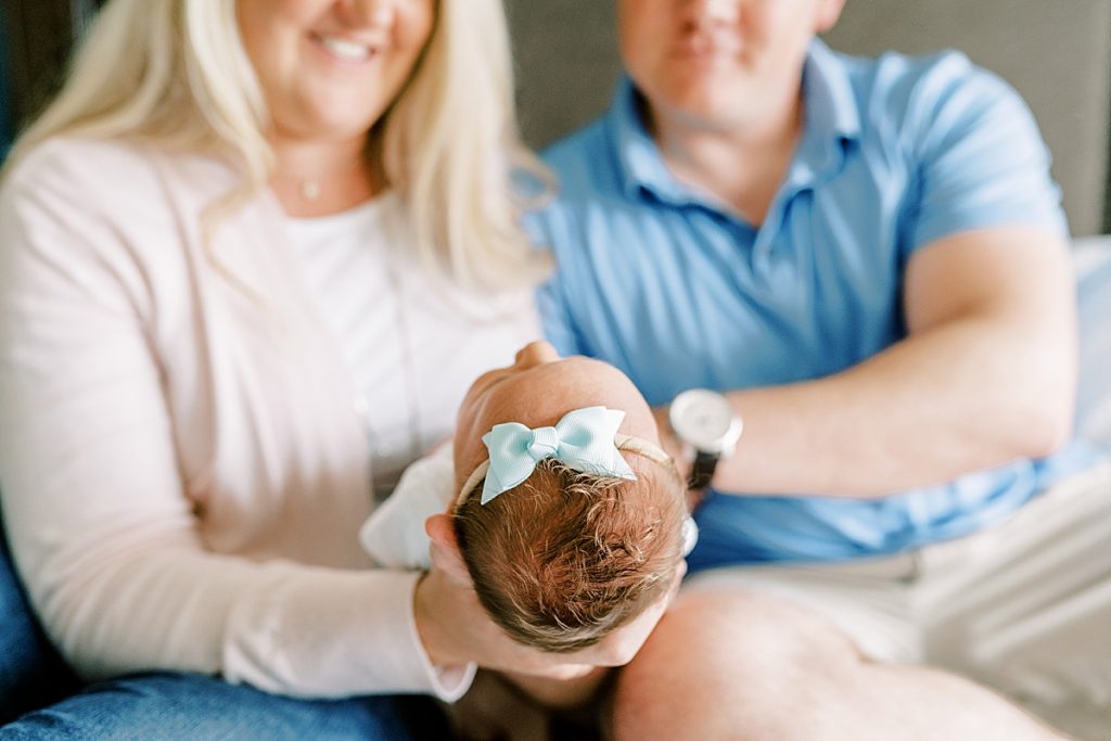Baby head in blue bow| in Fort Worth Lifestyle Newborn Family Session| Sabel Moments Photography 