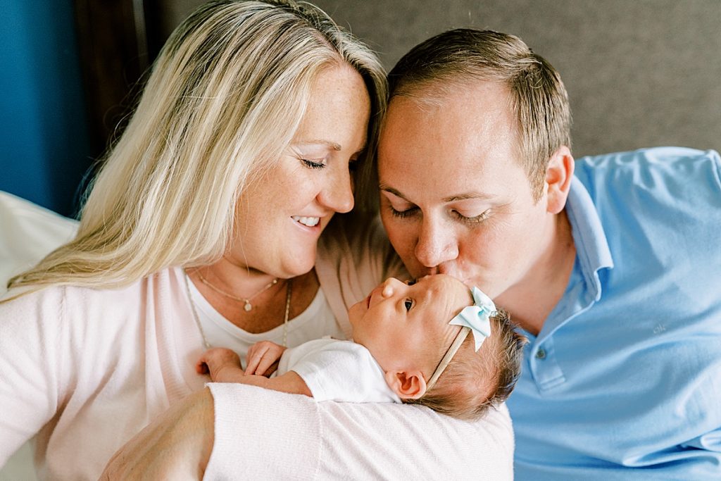 Parents cradling baby in Fort Worth Lifestyle Newborn Family Session
