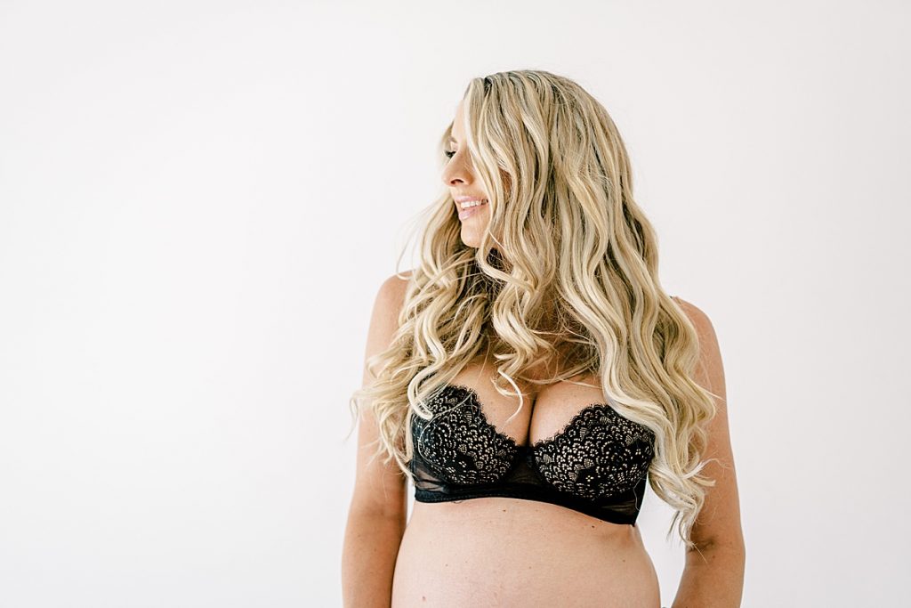 Pregnant blonde woman looking into distance