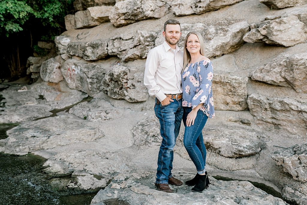 Couple standing on rocks in Trinity Park engagement session