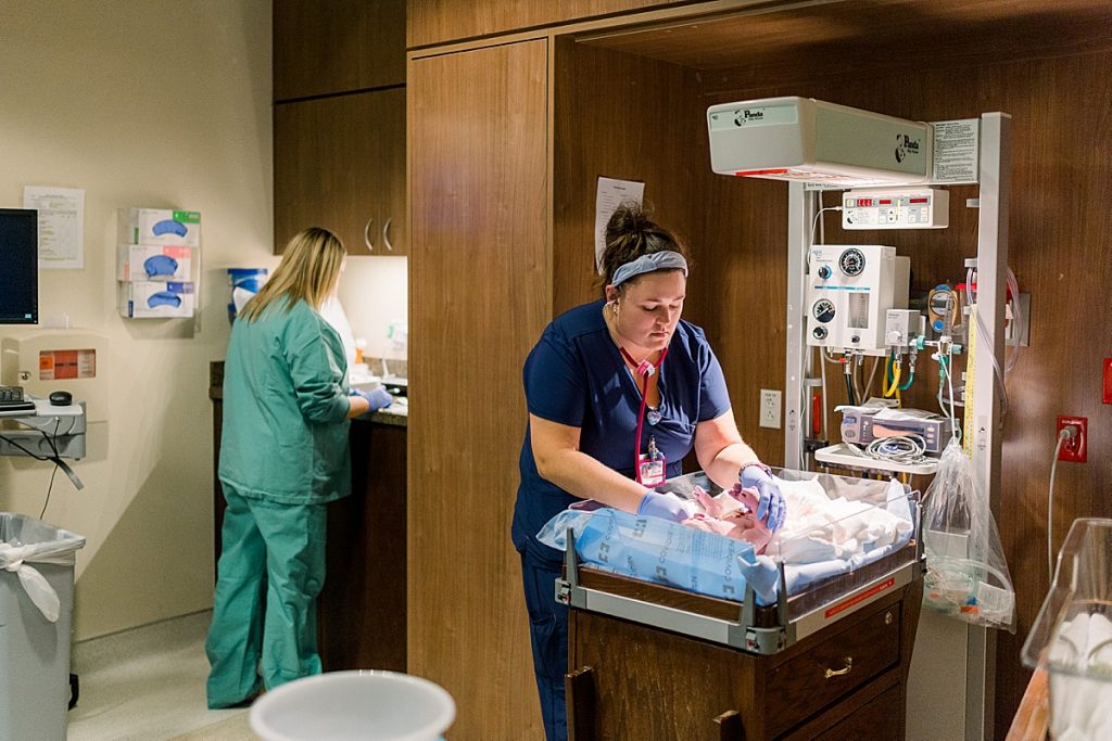 Nurse cleaning and measuring newborn at Texas Health Presbyterian Hospital