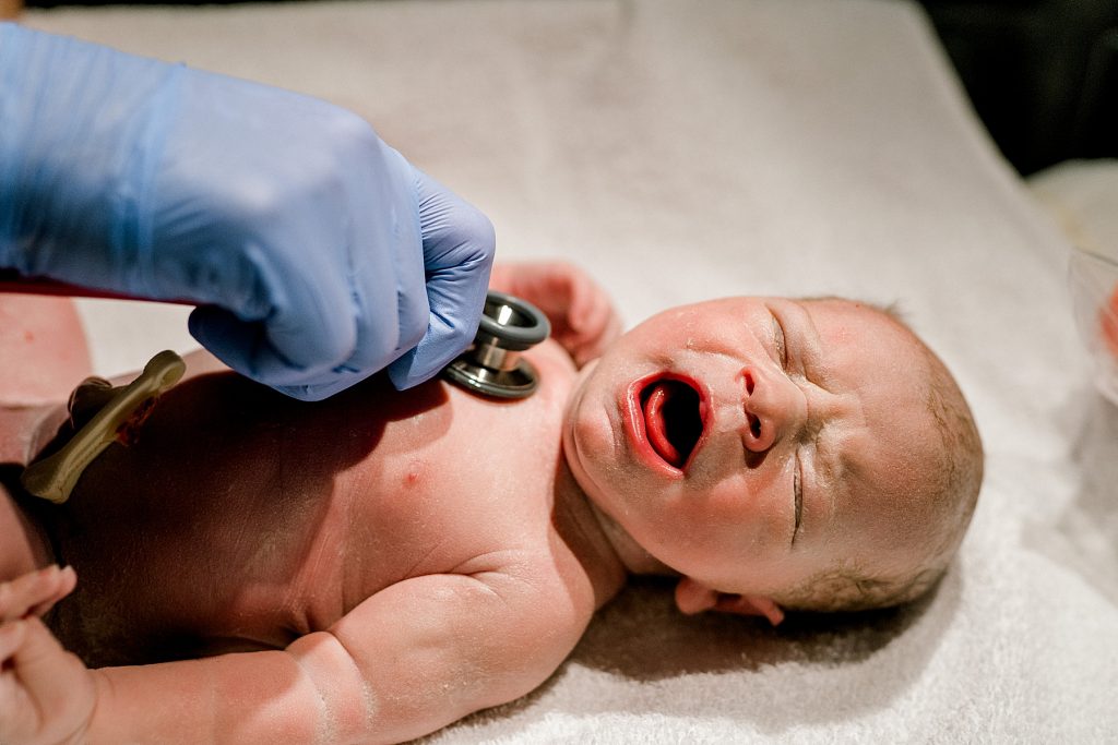 Checking heartbeat on newborn baby Cross!