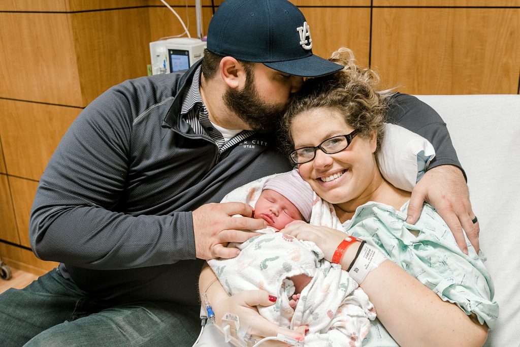 Parents holding newborn baby