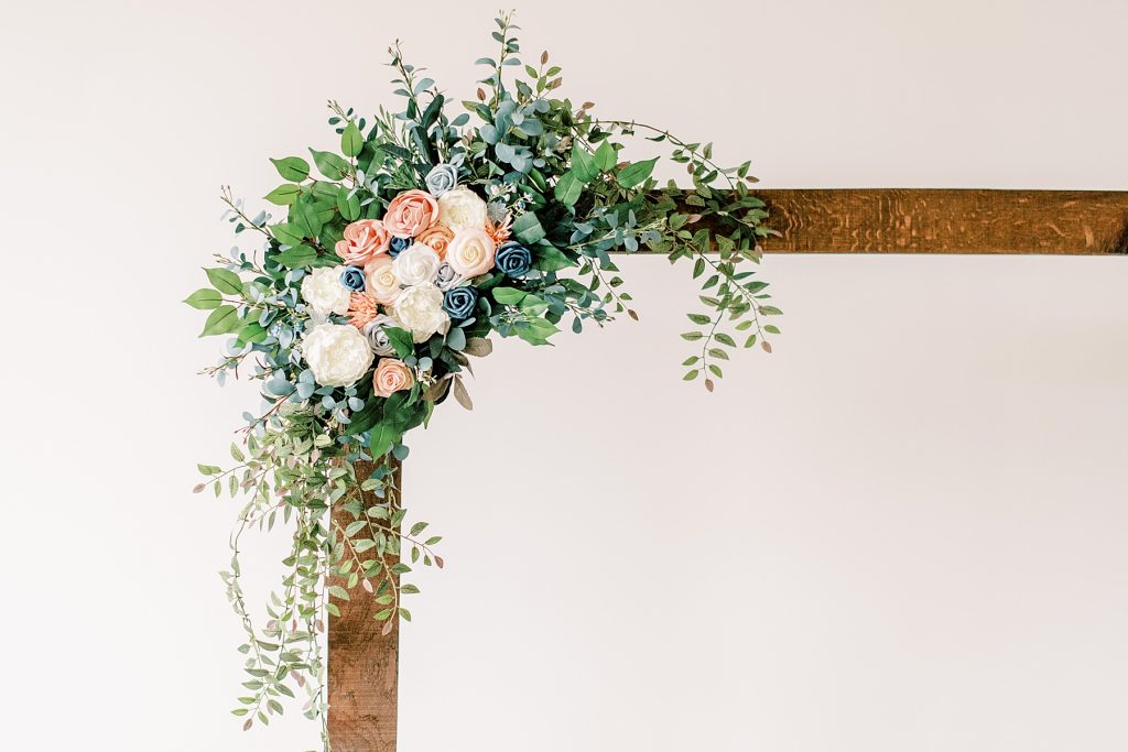 Wooden square wedding arch with blush and dusty blue florals