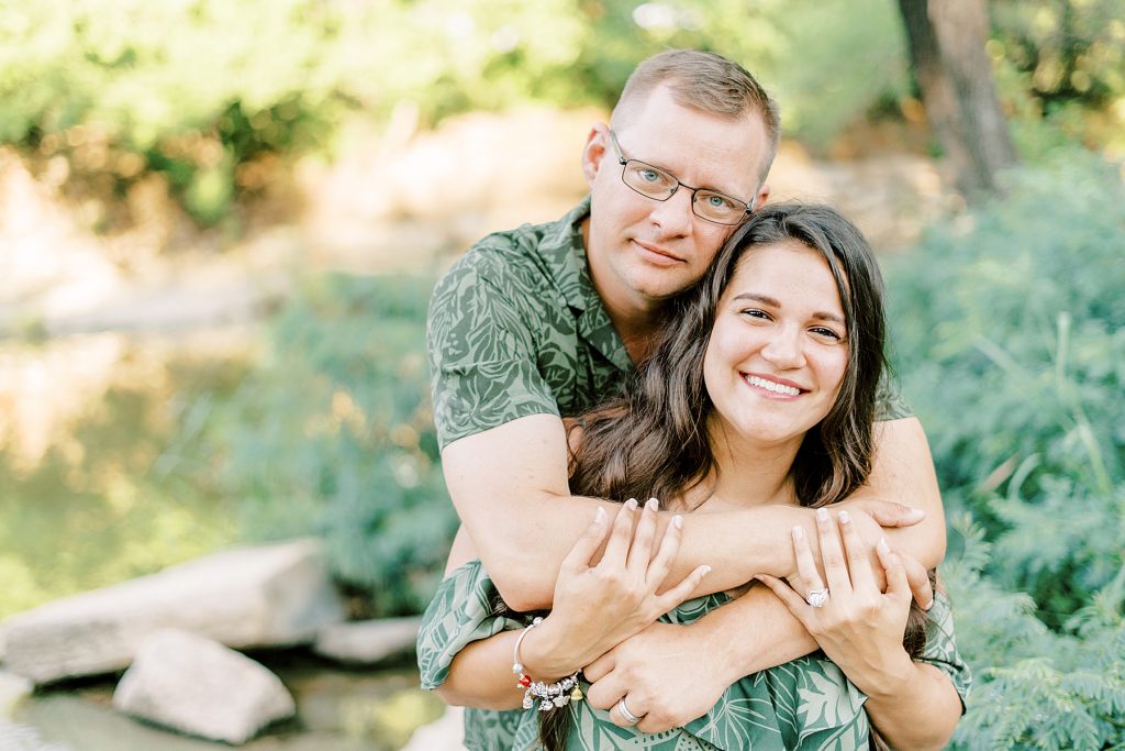 Guy hugs girl from behind at Airfield Falls  summer session 