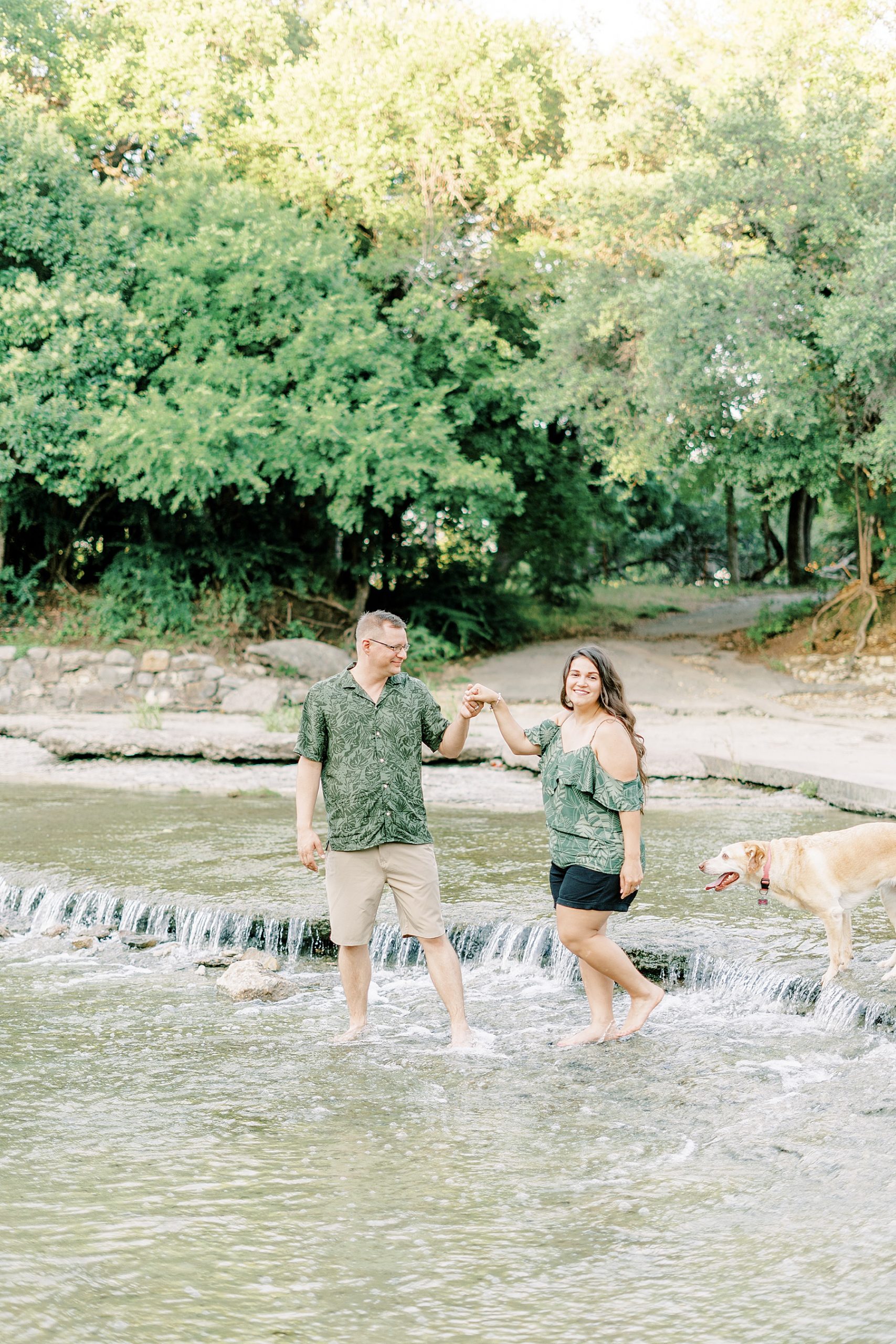 Couple laughing and playing in the water at Airfield Falls  summer session 