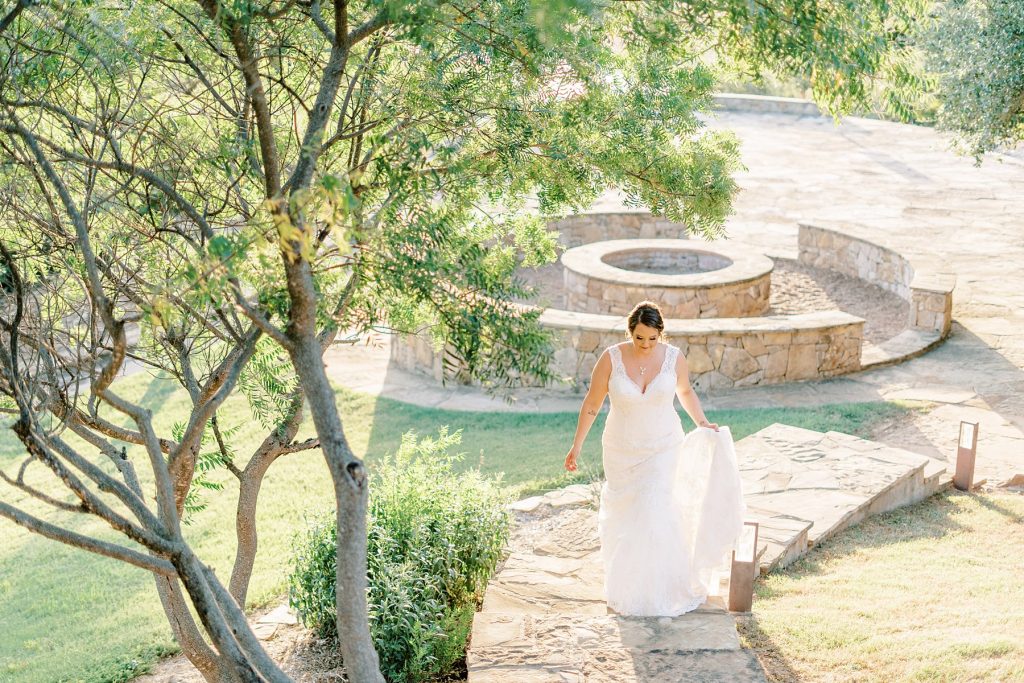 Bride walking up steps at Wildcatter Ranch