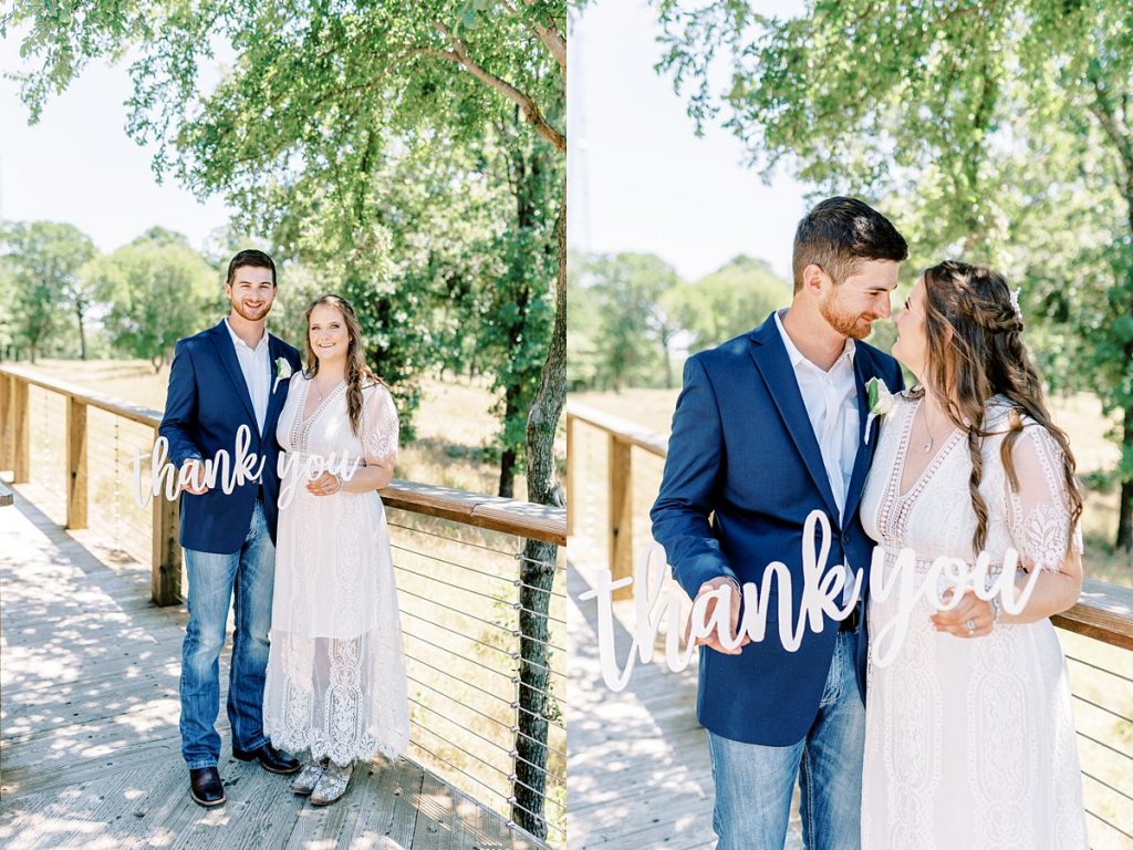 Bride and groom smiling holding thank you sign at Texas elopement
