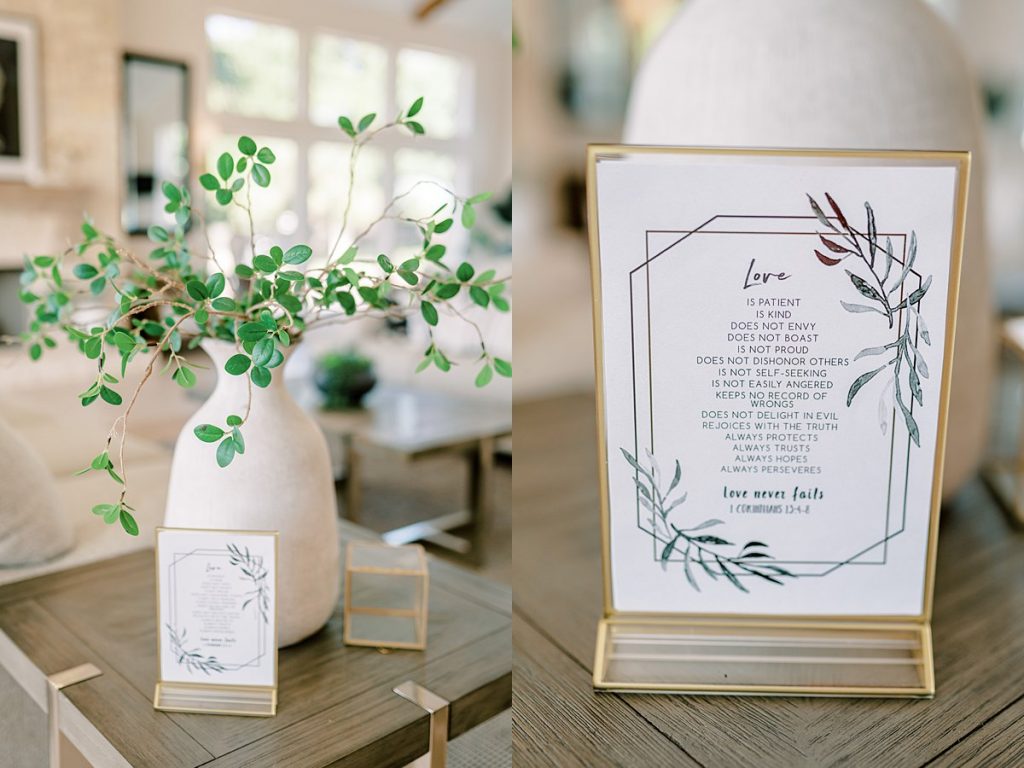 Greenery and wedding sign with 1 Corinthians 15 verse