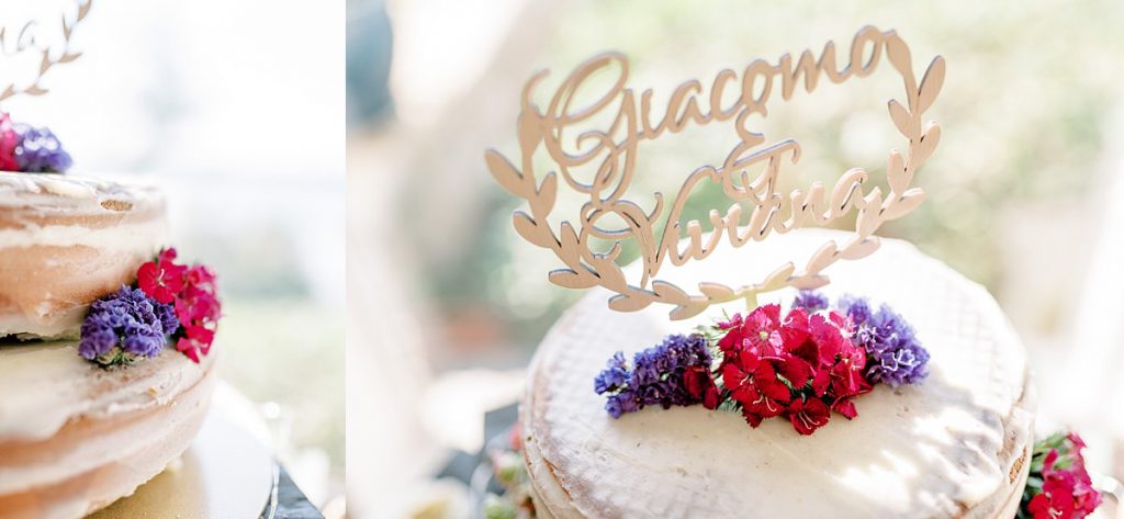 shaved wedding cake with tiny flowers and name cake topper