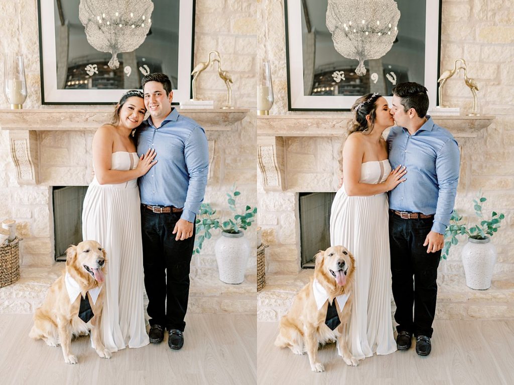 Bride and groom kiss with their dog standing beside them