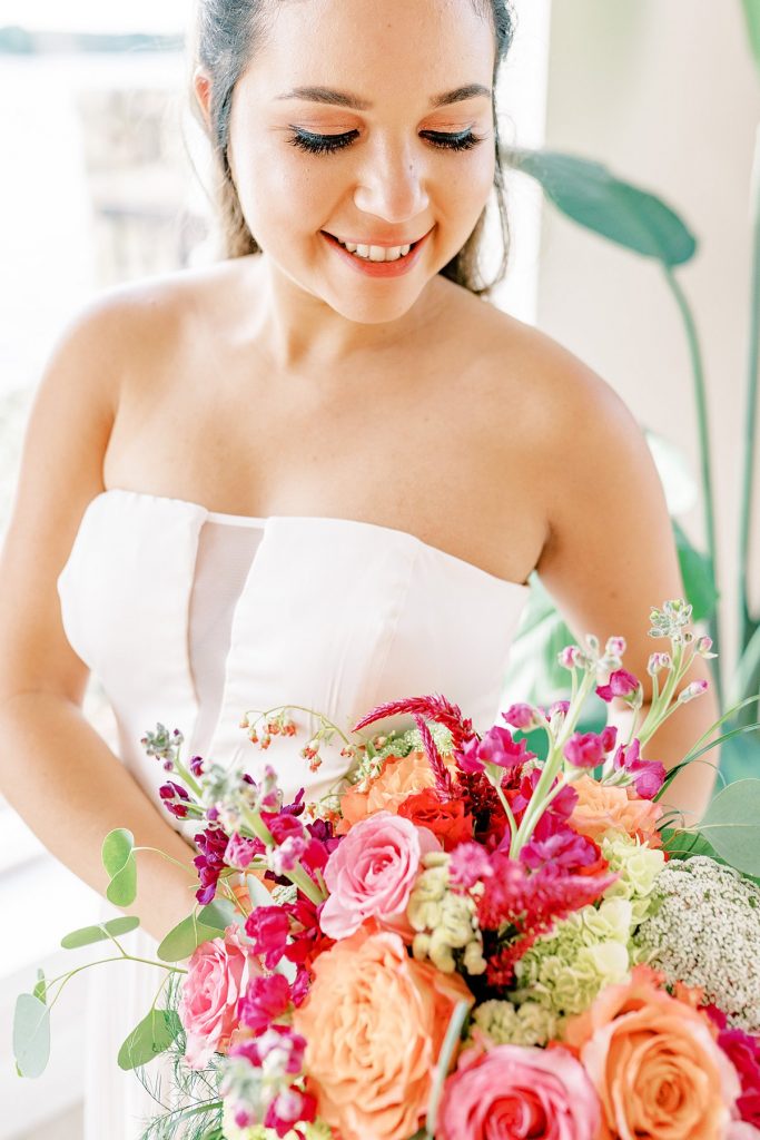Bridal portrait with pink and orange bridal bouquet in Lake Granbury elopement