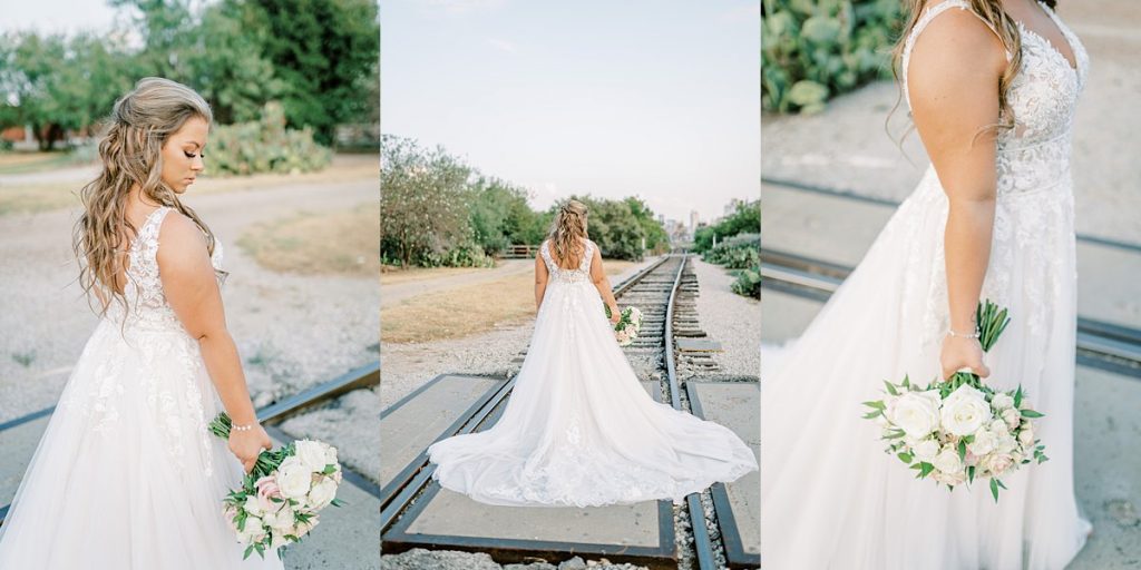 Bride standing on train tracks with white rose bridal bouquet in Fort Worth Stockyards bridal session
