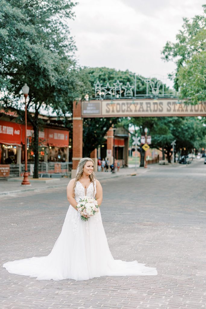 Bride standing in town square at Fort Worth Stockyards