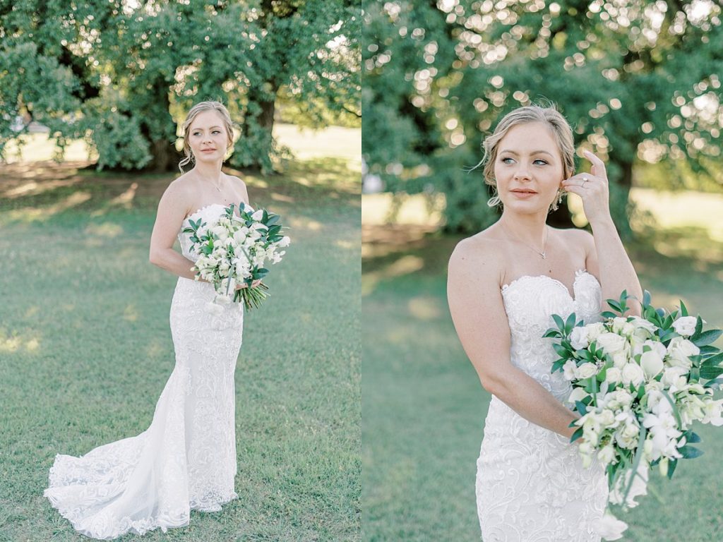 Bride holding white rose bouquet in field