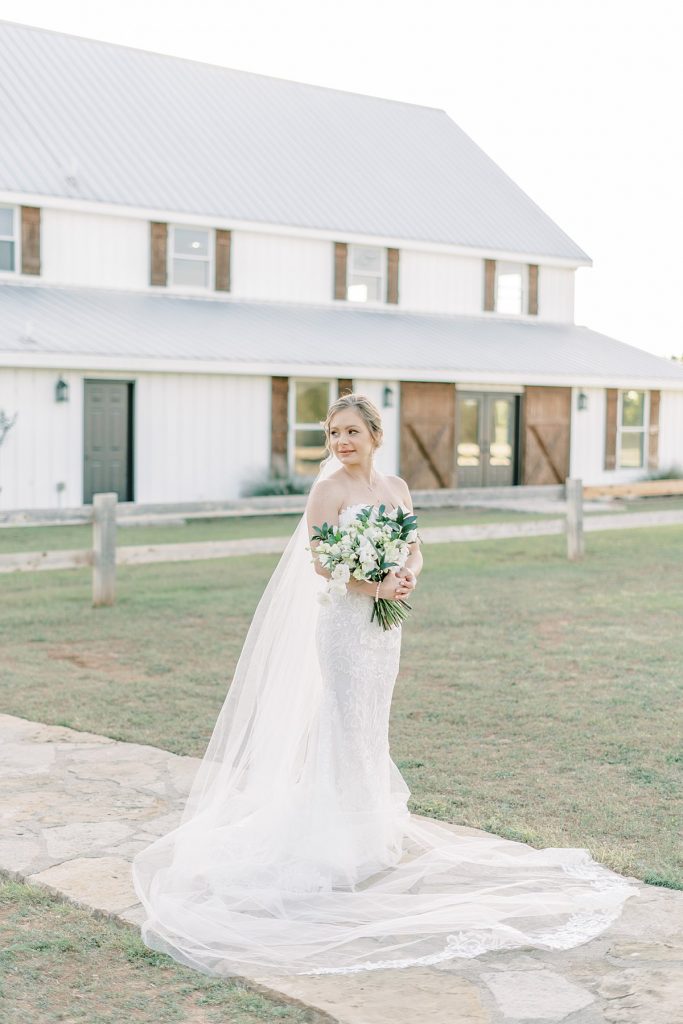 Bride standing in front of Five Oaks Farm