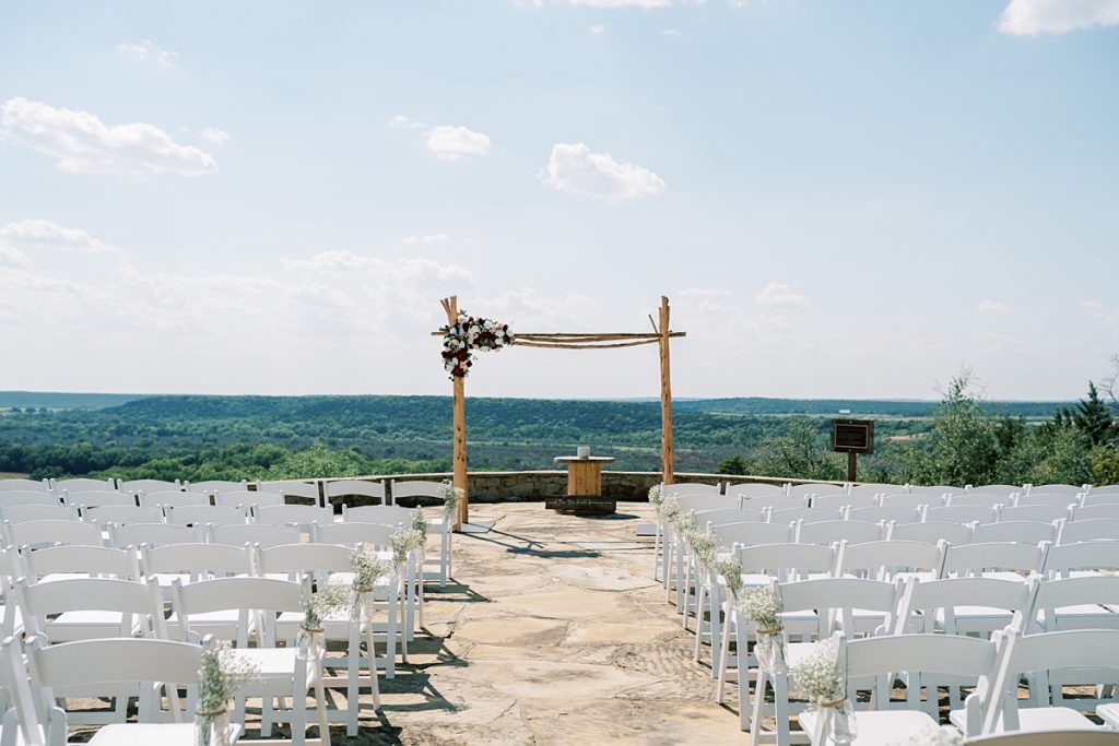 wood outdoor wedding arch at Wildcatter Ranch wedding