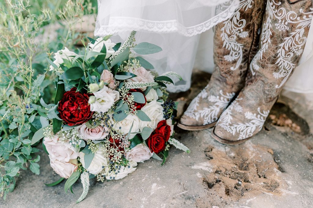 Rose bridal bouquet and wedding cowboy boots