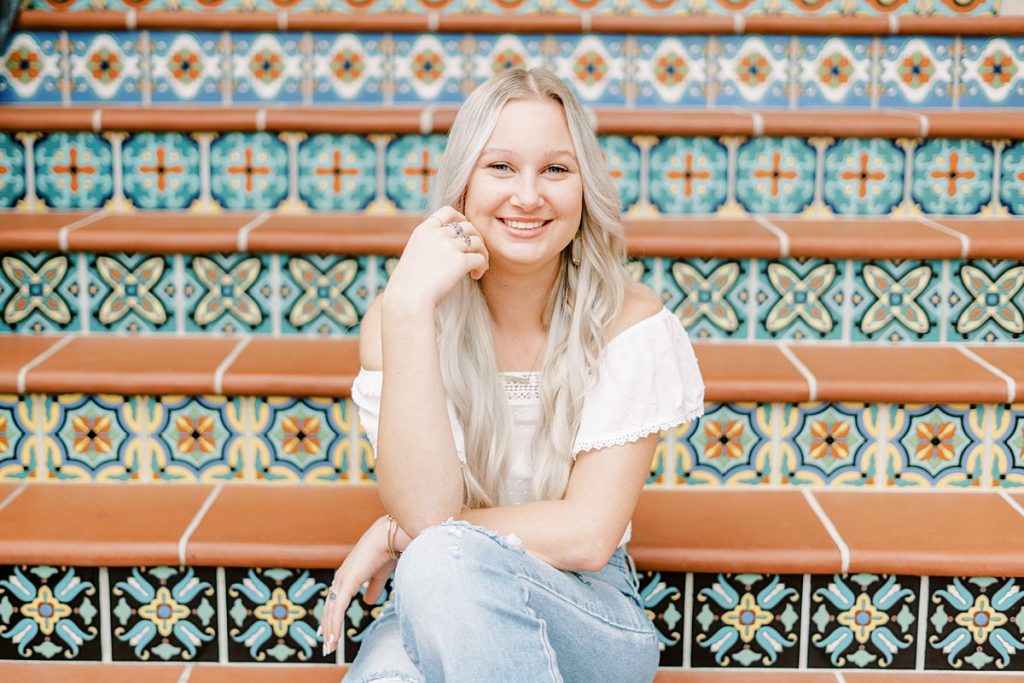 Girl sitting on staircase in Texas senior session