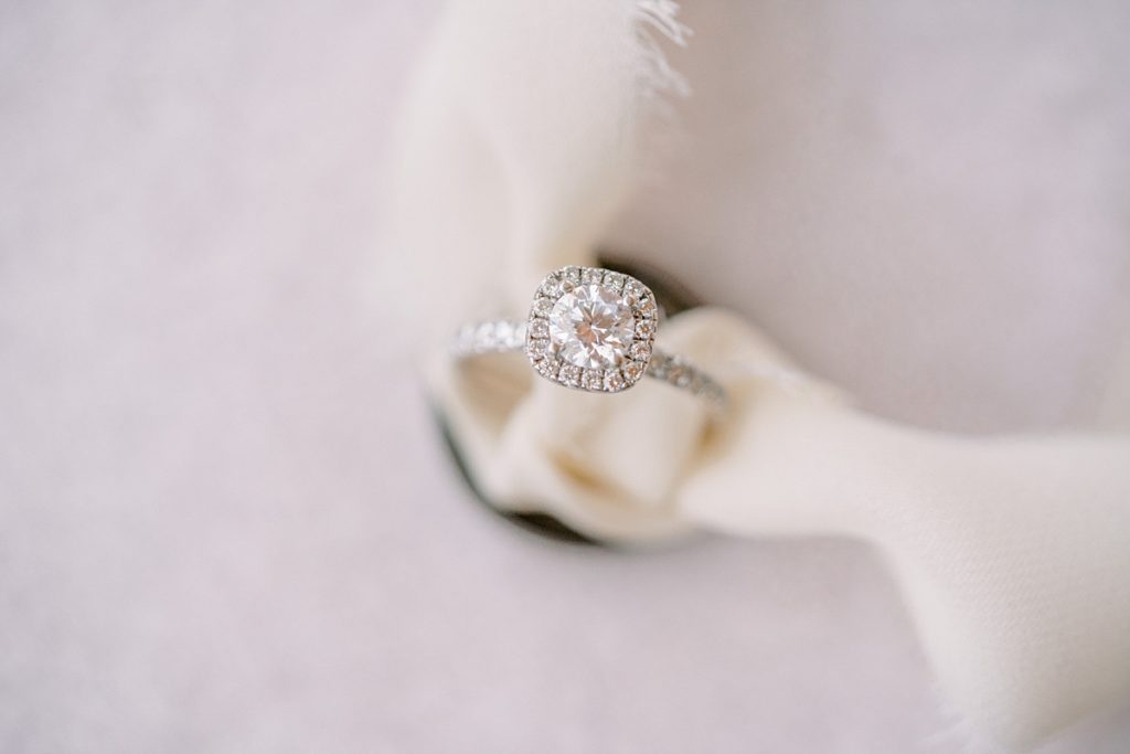 diamond wedding ring tied to ribbon