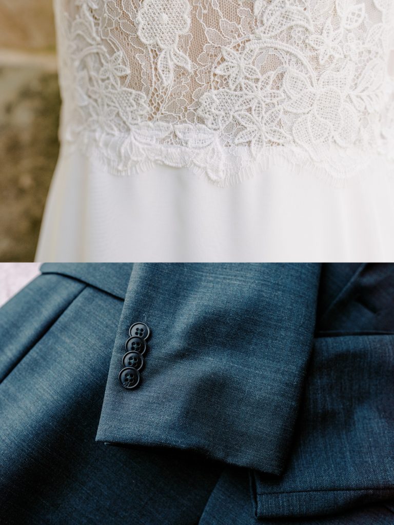 lace of wedding gown and sleeve of grooms suit