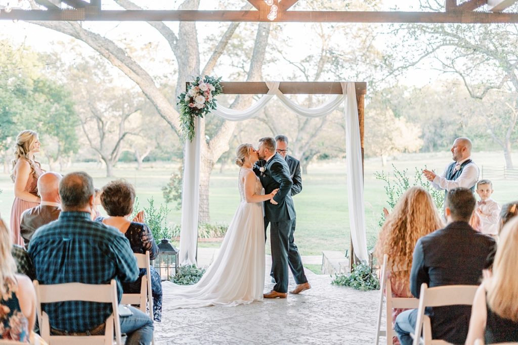 bride and groom kissing at The Orchard wedding