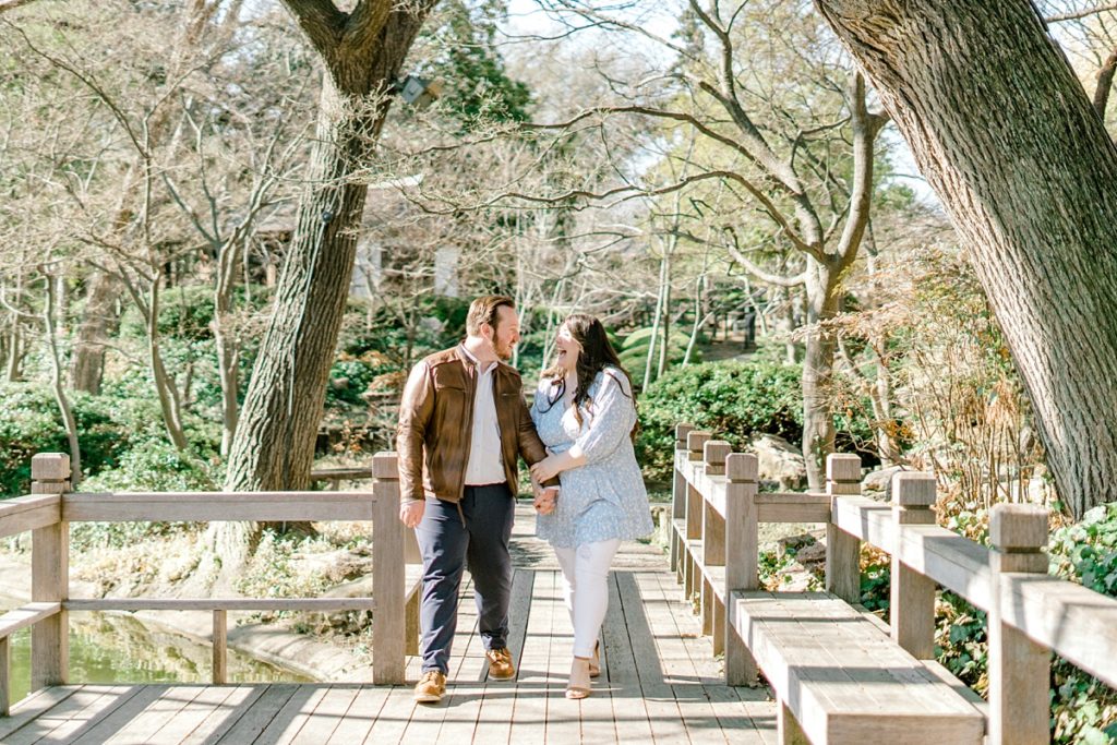 Couple walking through Fort Worth Japanese Botanical Garden